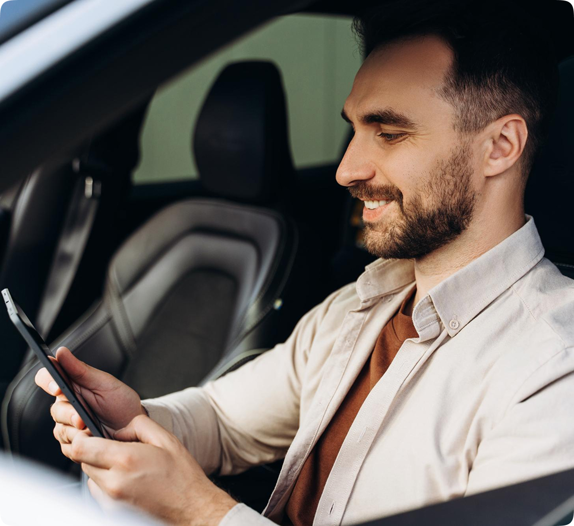 A driver communicating with his colleagues using a smart tablet