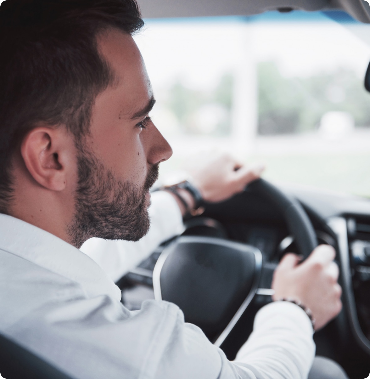 A man driving a car