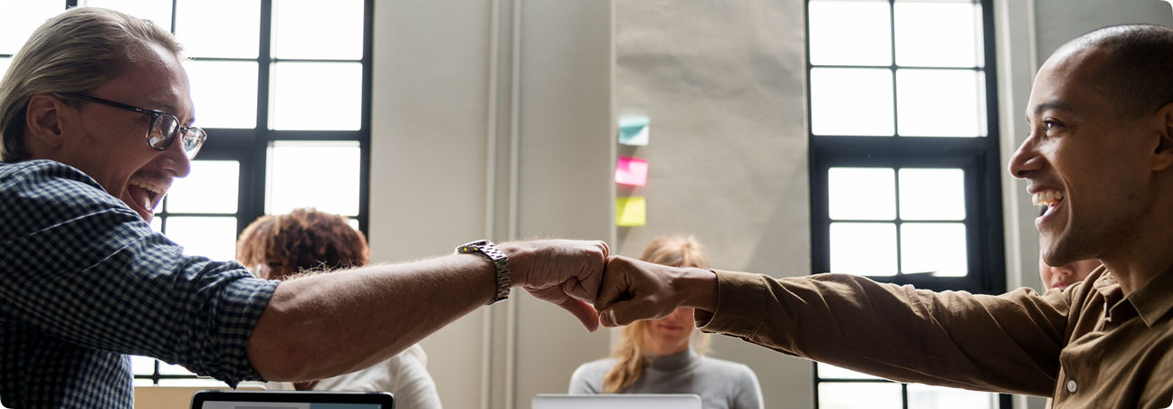 Two people bumping fists
